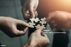 mobile jigsaw puzzle pieces business cooperation concept teamwork and cooperation Businessmen join a jigsaw team, charity, volunteerism, unity, teamwork.